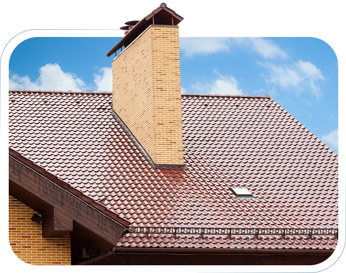 A roof with brown tiles and a beige chimney under blue sky.